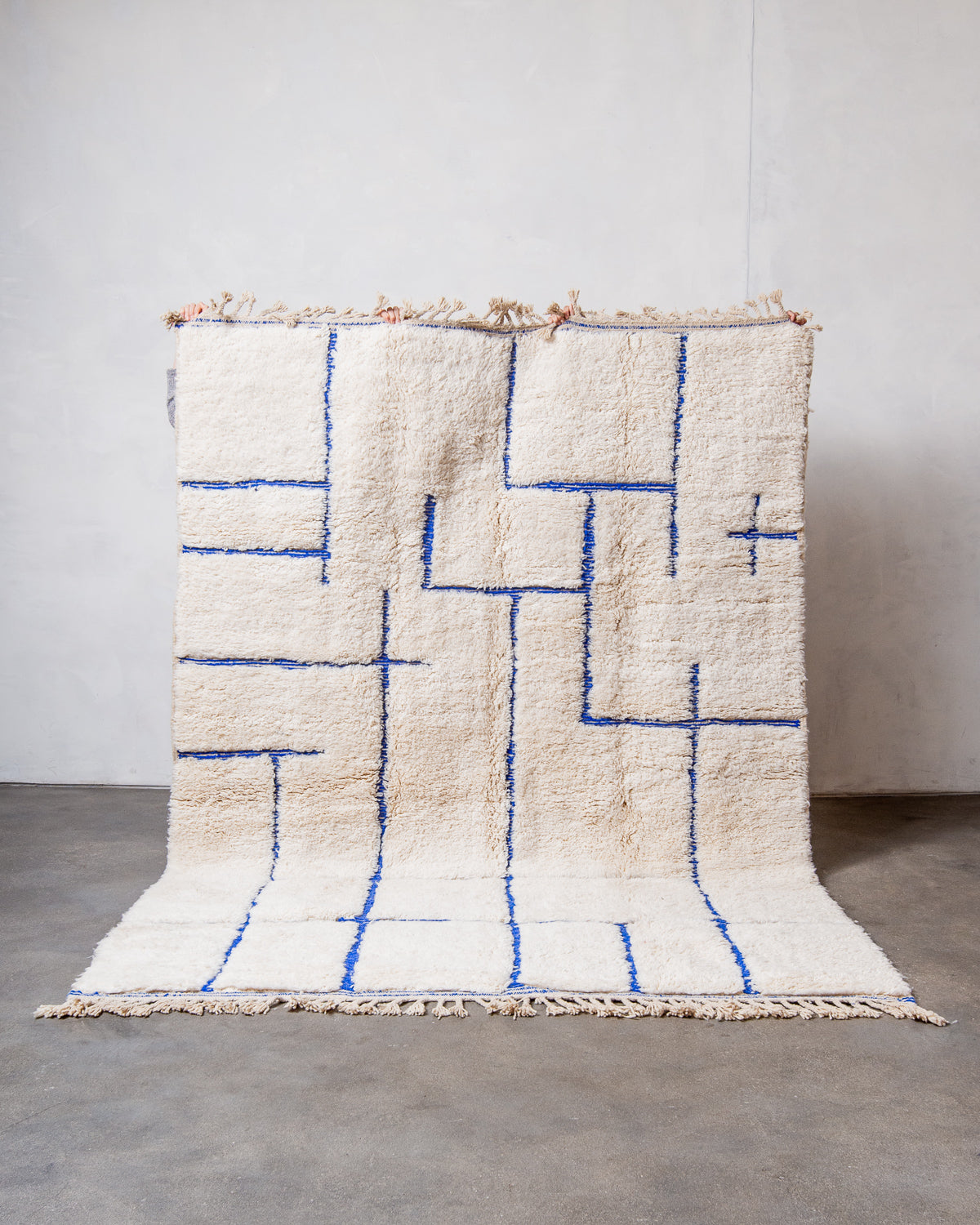 Modern, designer, handcrafted Berber rug from Morocco. Beniourain carpet with beautiful colours and patterns and fluffy wool texture.